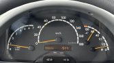 Car instrument panel showing speedometer up to 180 km/h, tachometer, fuel gauge mid‑range, and engine temp around 80°C; odometer reads 000022 and time 15:44