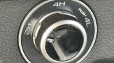 4WD transfer case dial showing 2H, 4H, and 4L with a push to engage in the center.