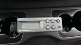 Thermo King control unit mounted in a vehicle’s center console, with display and round buttons.