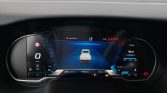 Digital car dashboard: central 3D car in blue lane, speed 0 km/h, fuel and engine indicators visible.