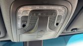 Overhead car console with status lights, sunroof/mapped lights, SOS button, and speaker/microphone grille.