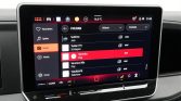 Infotainment screen showing FM/DAB radio list; Veronica is highlighted in red, left menu shows Radio selected.