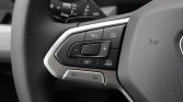 Steering wheel control cluster with cruise control buttons: RES, SET, +/- and CNCL, plus MODE button on the right side of the hub area.