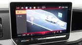 Car infotainment screen showing a navigation map with a white truck on a curved highway, speed limit sign 60, and a left-side menu labeled 'Scene' and 'Lijst'.