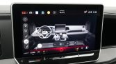 Touchscreen infotainment panel in a car showing climate controls and dashboard icons on a modern dashboard.