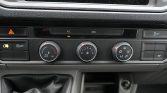 Car climate control panel showing A/C, fan speed, and temperature dials.