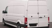 Rear view of a white Volkswagen Crafter cargo van with closed back doors and red taillights.