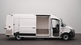 White cargo van with side and front doors open, showing an empty aluminum-floored cargo area ready for loading