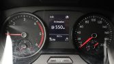 Car dashboard with tachometer left, speedometer right, and center display reading Actieradius 550 km and 16.5°C (odometer 78,298 km).
