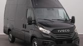 Dark gray Iveco cargo van from a front-three-quarter view, showcasing large high-roof cargo area and side panel doors