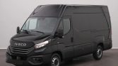 Black Iveco cargo van with high roof, shown in three-quarter front view indoors; clean, modern design and grille with Iveco emblem.
