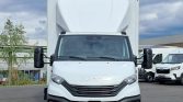 Front view of a white Iveco box truck with a tall cargo area, large black side mirrors, and a dark grille.