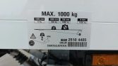 Load capacity plate on a trailer: MAX. 1000 kg with weight distribution markers and icons.