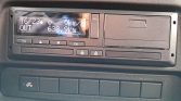 Dashboard display showing speed 0 km/h, outside temperature 16°C, and total distance 638.9 km; control buttons and a trailer-icon button visible below.