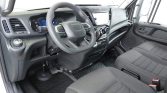 Driver's cabin of a modern van with IVECO steering wheel and digital dashboard