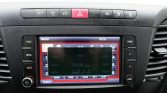 Car dashboard infotainment screen displaying a radio interface with frequency 93.60 MHz and preset buttons nearby.