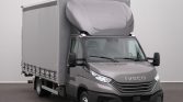 Grey Iveco delivery truck with a large box cargo area, front-right view in a studio setting.