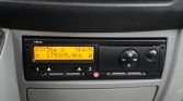 Dashboard car stereo with orange backlit display showing time 07:56, speed 0 km/h, and odometer 179309.4 km