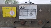 Close-up of a rusted metal plate with a yellow ON/OFF circuit switch and a white data label.