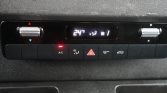 In-dash climate controls set to 24°C, with A/C button lit and hazard triangle button in the center.