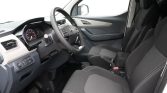 Interior of a car: steering wheel, dashboard with illuminated gauges, and two front seats.