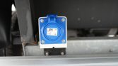 Blue PCE IPX8 electrical inlet mounted on a metal frame with a protective cover