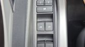Driver-side car window controls: four window switches with lock/unlock buttons above and a window lock button in the middle