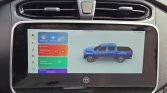 Infotainment screen showing Apple CarPlay with a blue pickup truck graphic on the right side of the display in a car interior.