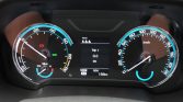 Car dashboard cluster showing speedometer on the right and tachometer on the left, with a central digital display reading Trip 1: 0.0 km and ODO 186 km; READY indicator lit in green.