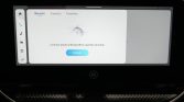 Car infotainment screen showing a Bluetooth connect prompt with a blue Connect button on the center panel and side icons