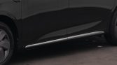 Black SUV side view showing a chrome running board along the lower door line and wheel on left, with a BAS badge on the front door area.