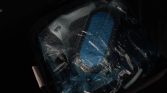 Blue foam-like insert sealed in a transparent plastic bag inside a dark carrying case.