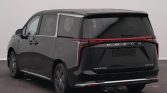 Rear three-quarter view of a black Maxus Mifa 9 minivan with distinctive vertical taillights and SAIC Motor branding on the tailgate.