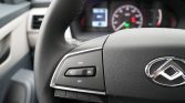 Steering wheel with Hyundai logo and cruise control buttons (RES+ and SET-) on the left side; dashboard blurred in the background.
