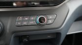 Vehicle climate control panel with circular temperature dial, A/C, defrost, airflow, auto mode, and fan controls