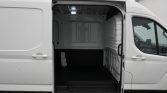White cargo van with side door open, showing an empty cargo area and dark floor.