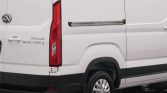 Rear-right view of a white Maxus Deliver 9 van, showing taillight, badge reading MAXUS DELIVER 9, and a silver wheel.