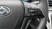 Close-up of a Hyundai steering wheel with audio controls: phone, volume, SRC, and mute buttons.