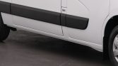 White cargo van side with black impact guards along the door panels and a small BAS sticker near the hinge area.