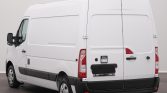 White Renault cargo van viewed from the rear three-quarter angle in a studio setting.