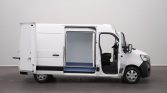 White cargo van with side door open, exposing a blue cargo floor and driver’s seat visible from the side.