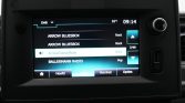 Car infotainment touchscreen showing radio list with Arrow Bluesbox and ArrowClassicRock, time 09:14, 16°C, option buttons at bottom.