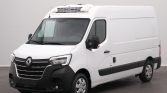 White Renault cargo van with a rooftop refrigeration unit, black front bumper, and silver wheels parked indoors.