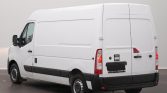 White cargo van shown from the rear-right side in a studio setting, with closed rear doors and black bumper detailing.