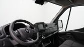 Dashboard of a Renault van with steering wheel, center touchscreen, and manual gear lever.