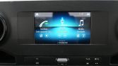 In-car touchscreen displaying Phone, Radio, and Media Bluetooth options (Dutch labels: Telefoon, Radio, Media).