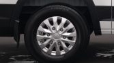 Close-up of a silver multi-spoke car wheel with a Cooper tire and Hyundai center cap on a white vehicle.