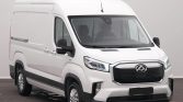 White high-roof cargo van shown from a front-right angle, with a prominent black grille and headlights.