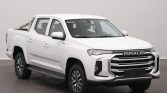 Front three-quarter view of a white Maxus pickup truck in a studio setting, showcasing its bold grille and modern headlights.