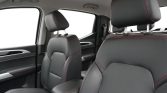 Interior of a car showing black leather seats with red contrast stitching and adjustable headrests, visible front seats and center console. Readable for a screen reader as a vehicle cabin description.